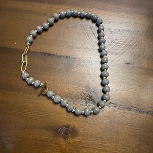 Gray beaded clay front clasp necklace
